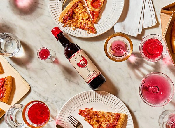 Pizza Hut Tomato Wine surrounded by pizza